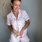 Girl wearing floral print pyjamas.